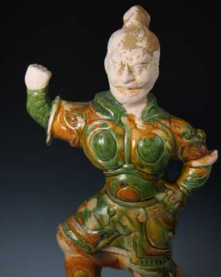 A Chinese Sancai-Glazed Clay Guardian Figure, Tang Dynasty,   618-907 AD