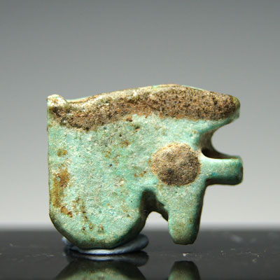 An Egyptian green glazed faience Wedjet Eye, Late Period ca 664 - 332 BC