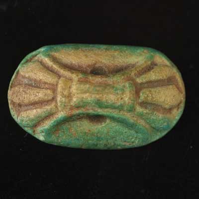 An Egyptian green glazed faience stamp seal, New Kingdom ca 1550-1069 BC