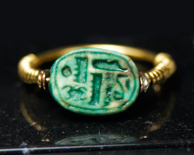 A very fine Egyptian green glazed steatite scarab, 18th Dynasty, time of Tuthmosis III, ca. 1479-1425 B.C.
