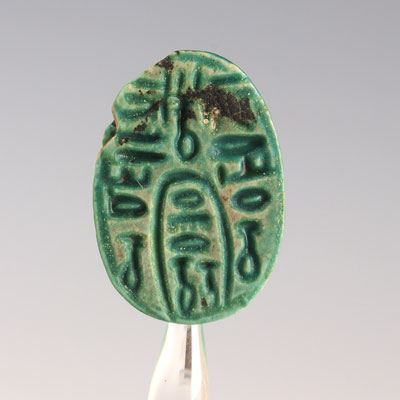 An Egyptian green glazed "anra" protection scarab, Middle Kingdom  ca 1502  1482 BC