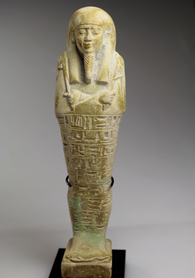 A large Egyptian Green Glazed Faience Ushabti for Psamtik, born of Amenirdis, 26th Dynasty c. 664 -525 B.C.