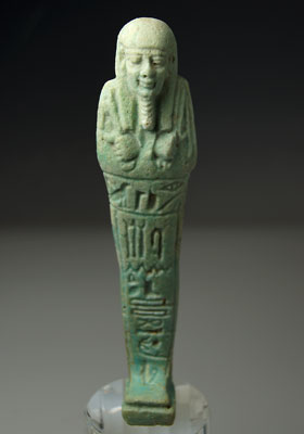An Egyptian Green Glazed Faience Ushabti for Horpenaset, 30th Dynasty c. 365 -332 B.C.