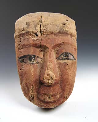 An Egyptian Wood and Polychrome Anthropoid Mask, Late Period c. 664 - 332 B.C.