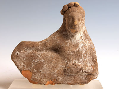 An Etruscan terracotta Banqueteer, ca 4th century BC