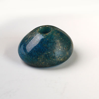 A large, early Islamic Glass bead, ca 8th century AD