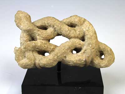 A rare Judaic limestone snake, ca 5th century AD