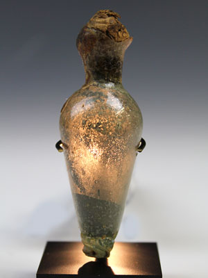 A sealed Islamic glass bottle with original contents, ca 7th century AD