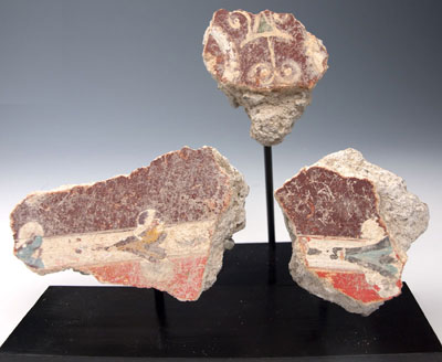 A group of three Roman fresco fragments, ca 1st century AD