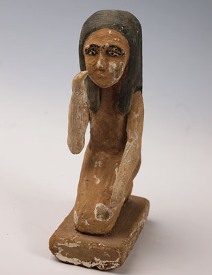 An Egyptian kneeling figure of a girl, early Roman Period ca 1st century BC/AD