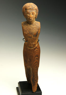 An Egyptian Wood Figure of a Man, Middle Kingdom, ca 2055-1773 B.C.