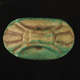 An Egyptian green glazed faience stamp seal, New Kingdom ca 1550-1069 BC