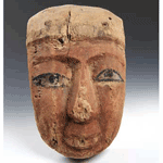 An Egyptian Wood and Polychrome Anthropoid Mask, Late Period c. 664 - 332 B.C.