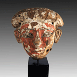 An Egyptian Wood and Polychrome Anthropoid Mask, 21st Dynasty ca 1069 - 945 BC