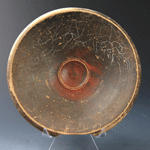 An Ionian black glazed terracotta Fish Plate, ca 4th century BC