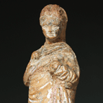 A charming Greek terracotta of a young girl, ca 3rd century BC