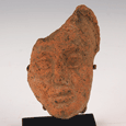 A Roman terracotta face of a god, ca 1st century AD